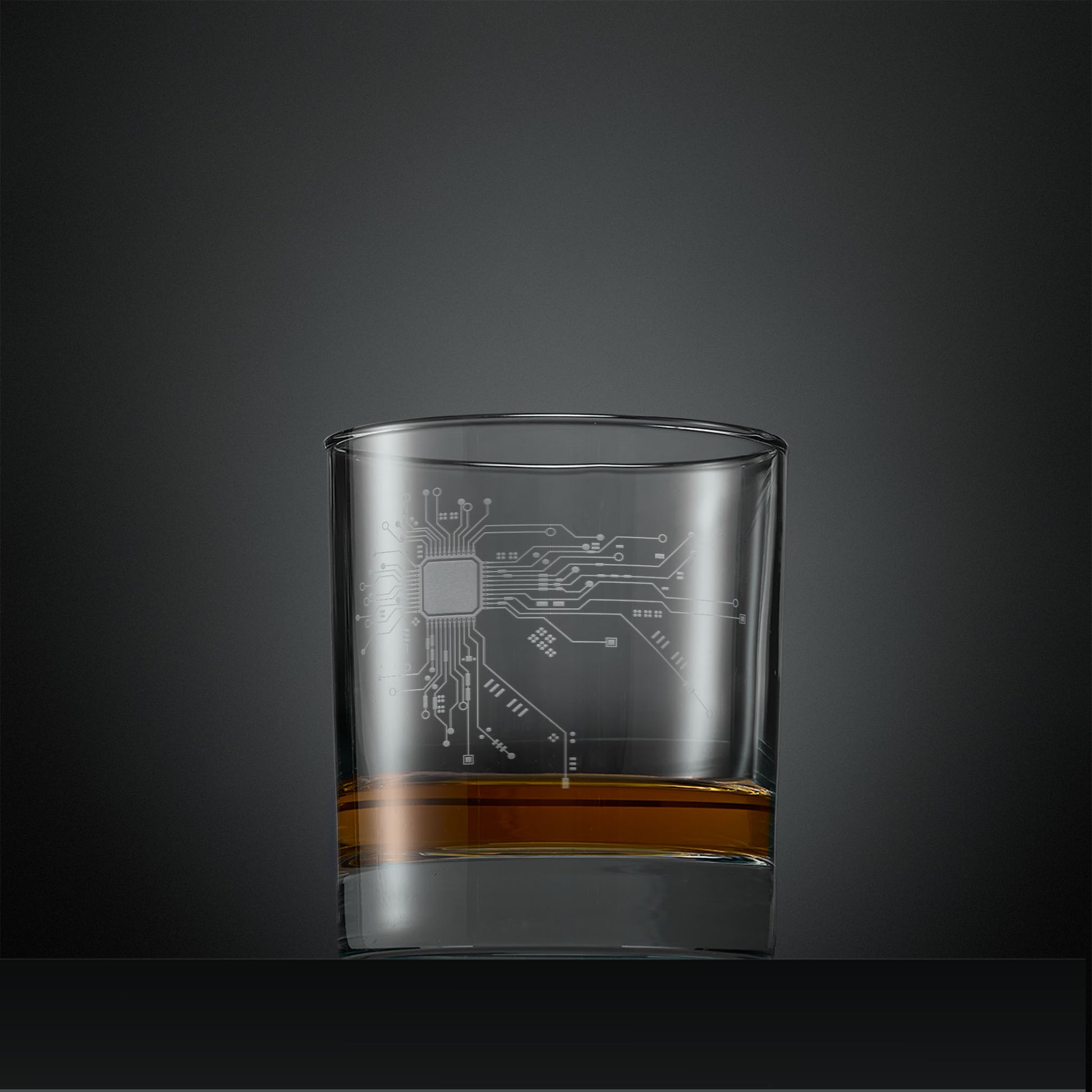 Engraved whisky glass with circuit board design