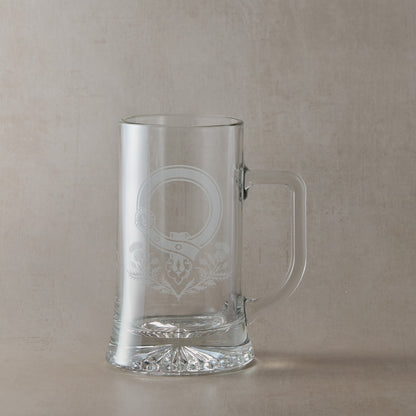Clear glass tankard with engraved Scottish Clan Crest buckle and thistles with handle on the right