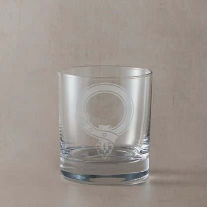 Engraved whisky glass featuring a Scottish clan crest with belt and buckle motif, centre left blank for your own design