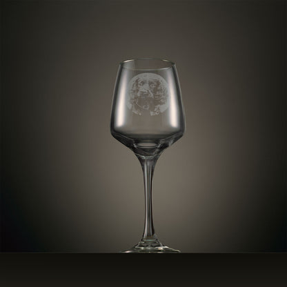 Engraved wine glass featuring a portrait Cocker Spaniel design, shown on a dark studio background