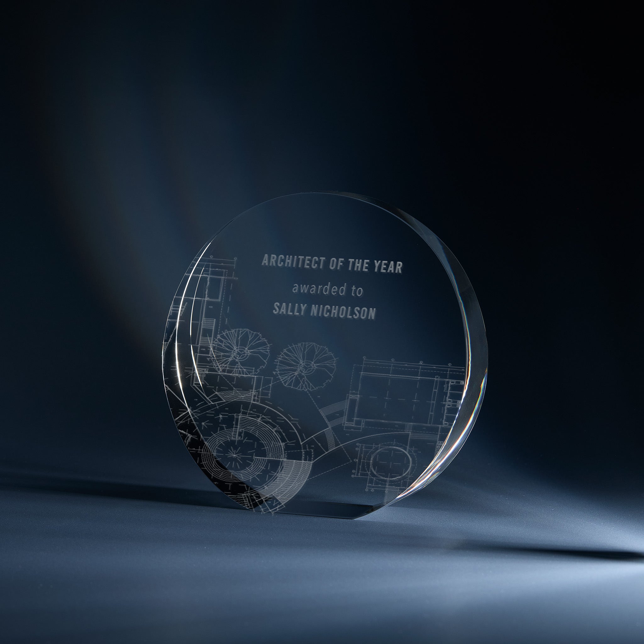 Engraved optical crystal round award with personalised inscription and corporate branding