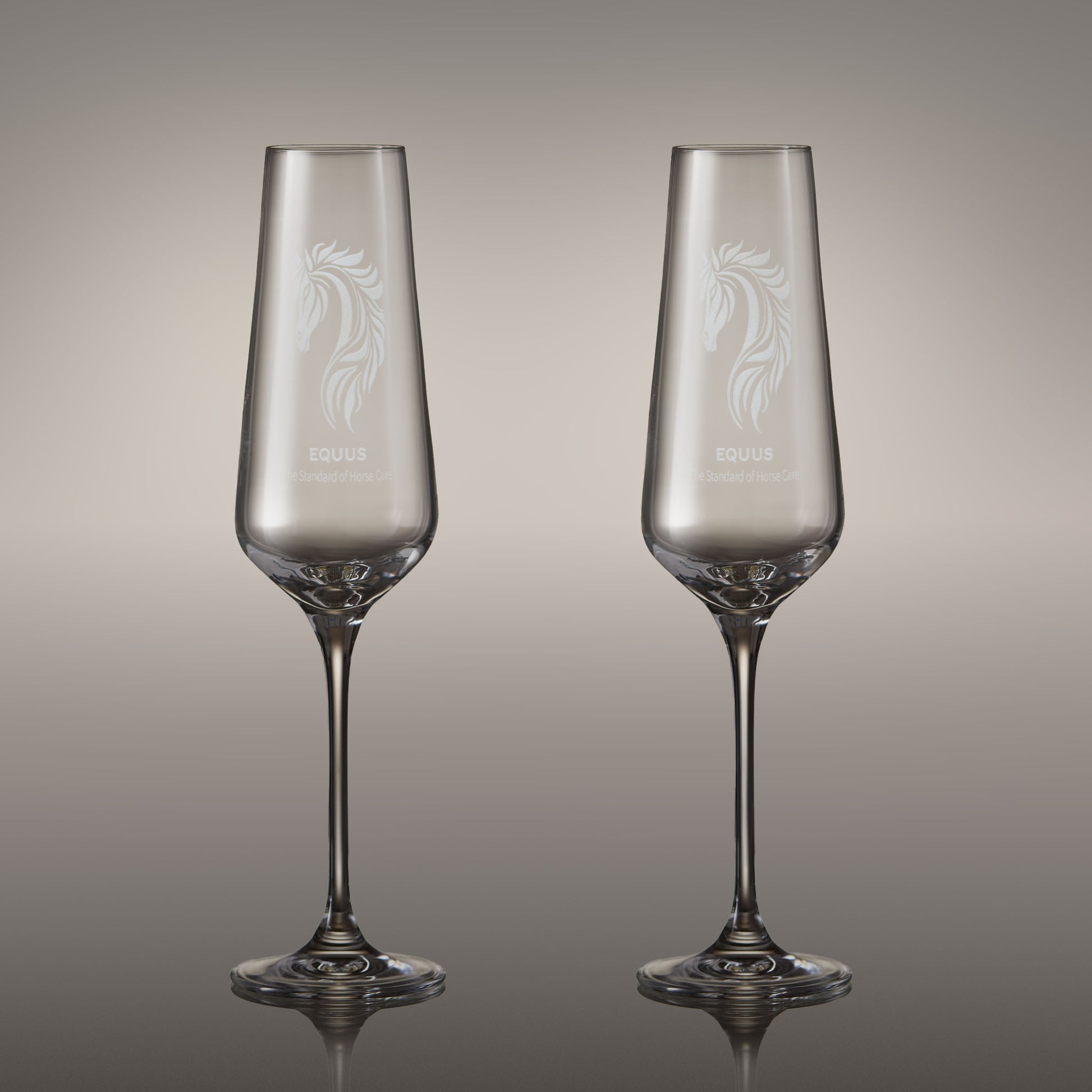 Pair of engraved champagne flutes with corporate logo