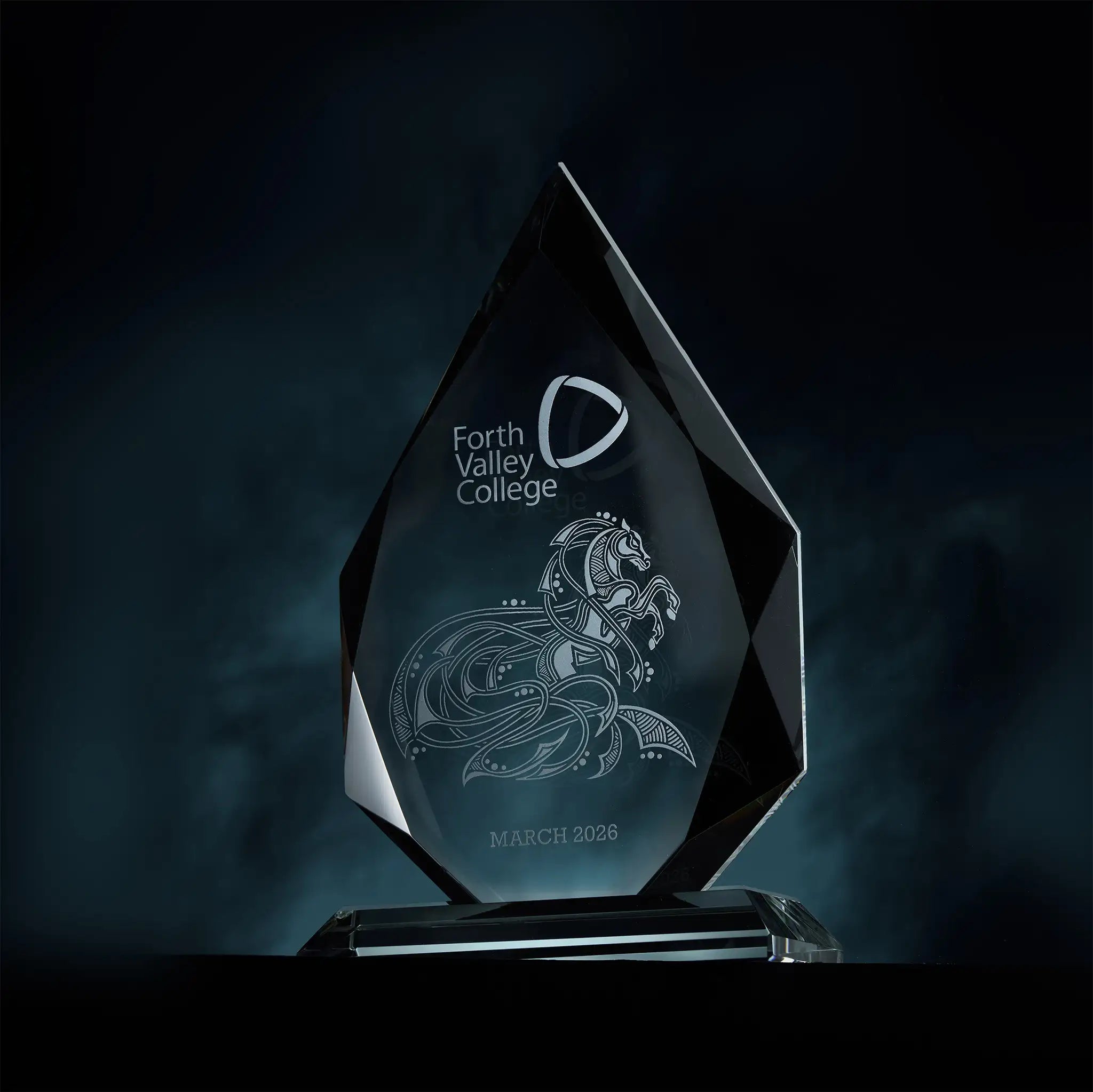 Corporate award with engraved design and personalised text on a dark background