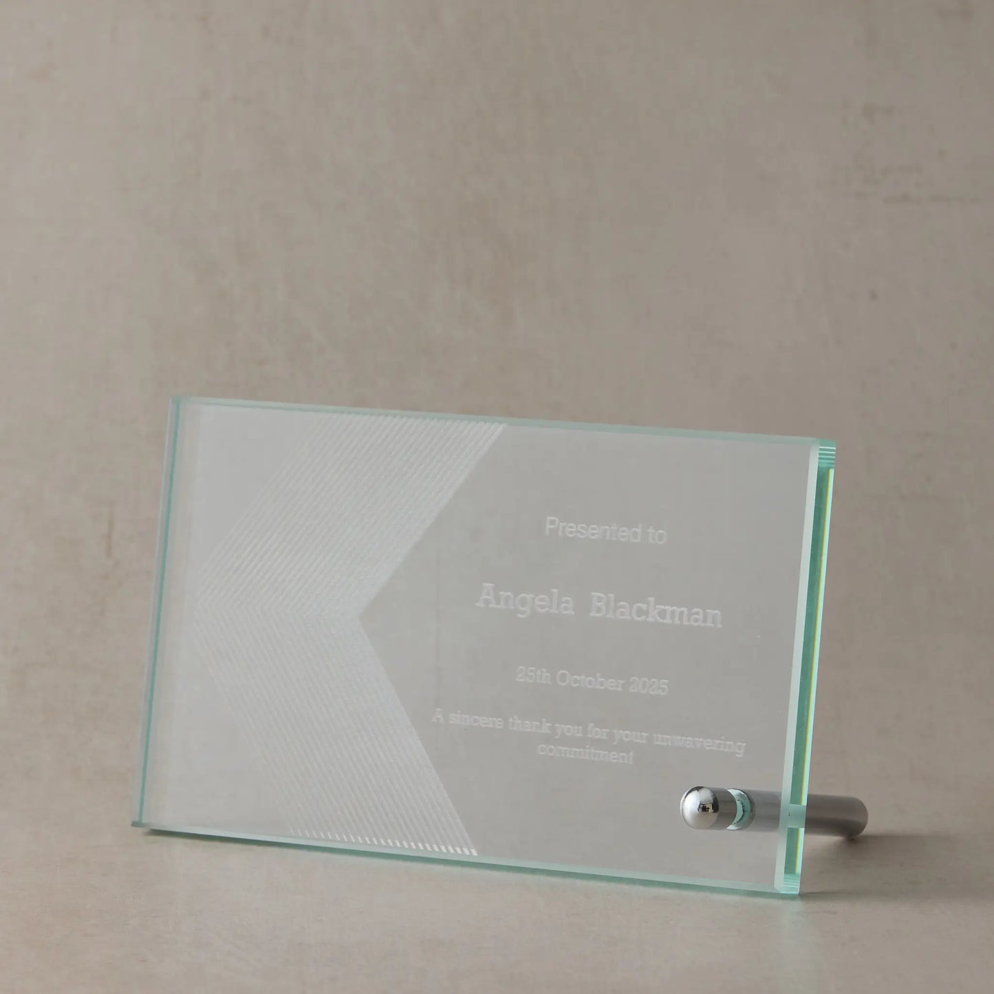 Personalised engraved jade glass rectangle award with custom corporate logo and text, displayed on a soft neutral background