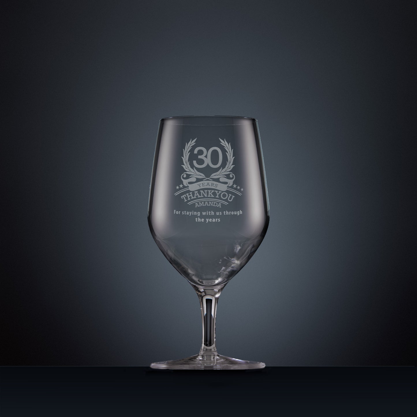 Engraved mineral water glass with laurel wreath design and years of service thank you message