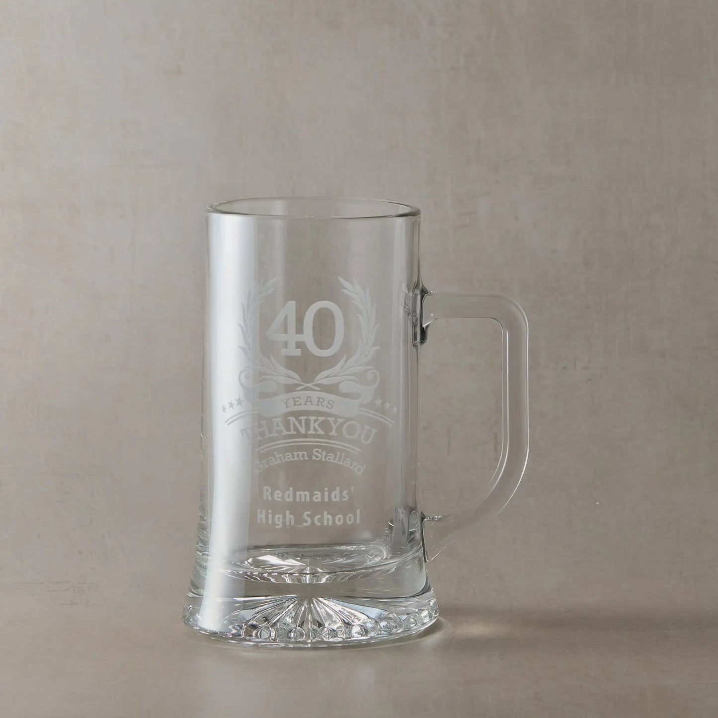 Engraved tankard with the number ‘40’ inside a laurel wreath, surrounded by stars, with personalised name and message