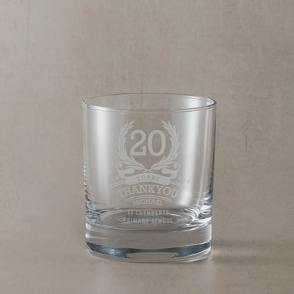 Anniversary year employee recognition whisky glass engraved with wreath, stars, and personal message