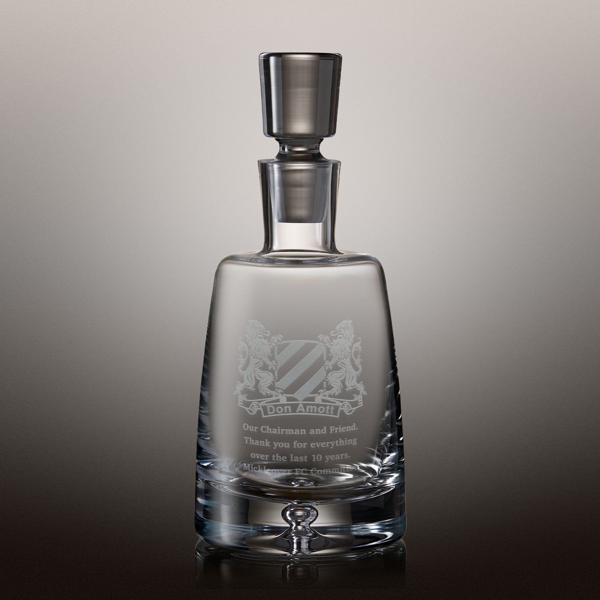 Engraved spirit decanter with crest design and personalised message