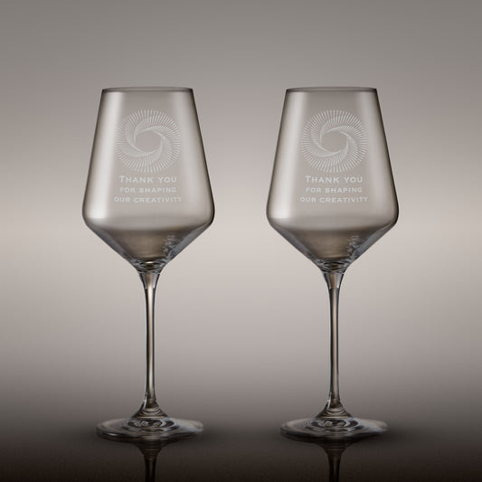 Pair of engraved wine glasses with corporate logo and inscription