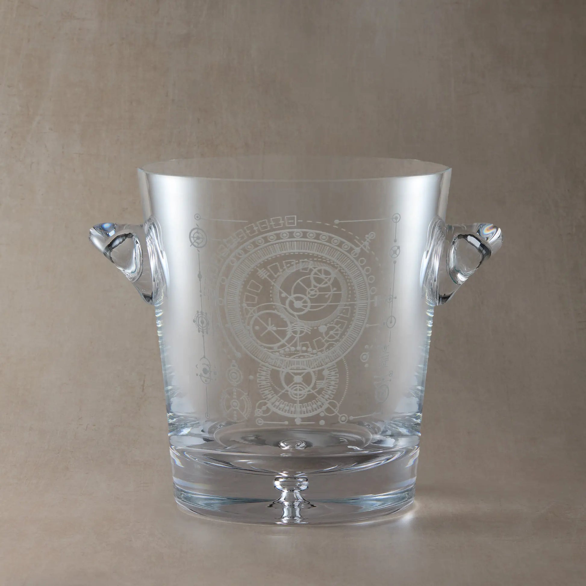 Champagne ice bucket engraved with custom corporate logo shown on a beige background