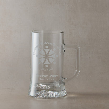 Glass tankard with a corporate logo and a personalised engraved message on a white background