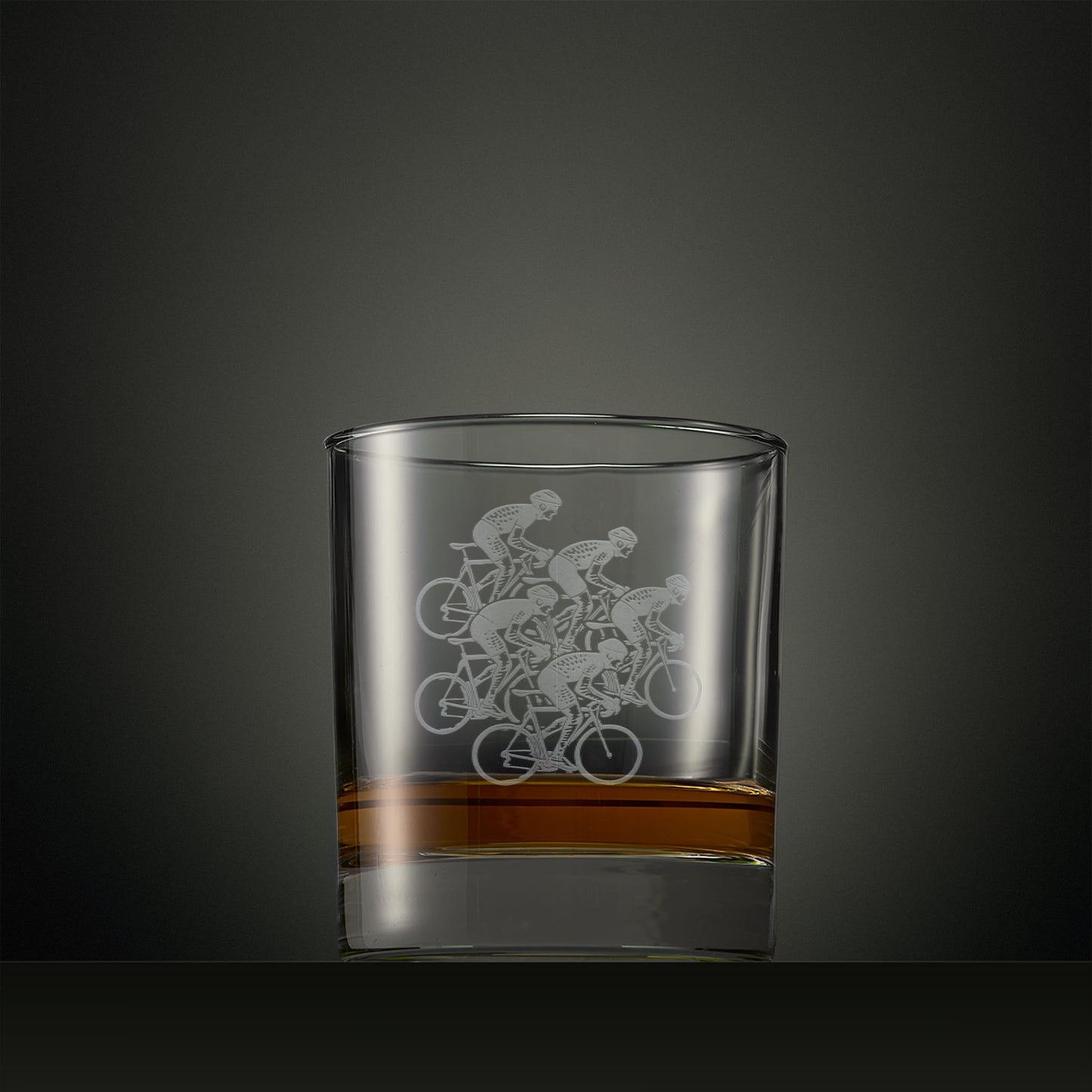 Whisky glass engraved with five cyclist silhouettes, personalised cycling gift.