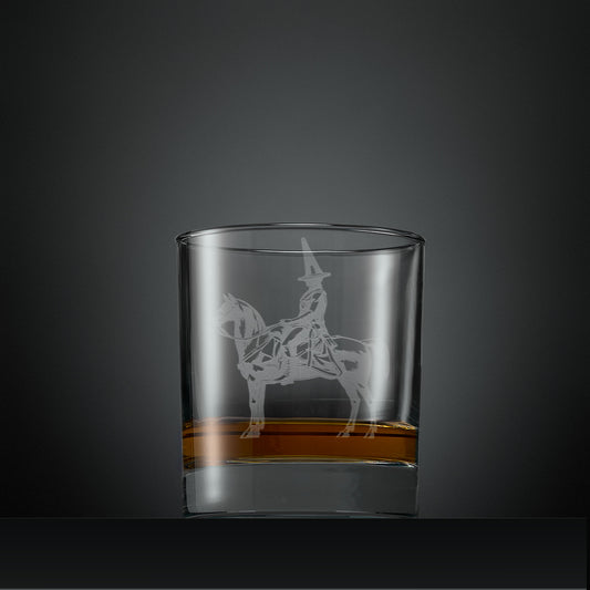 Glasgow whisky glass with engraved Duke of Wellington and traffic cone design on a dark gray background