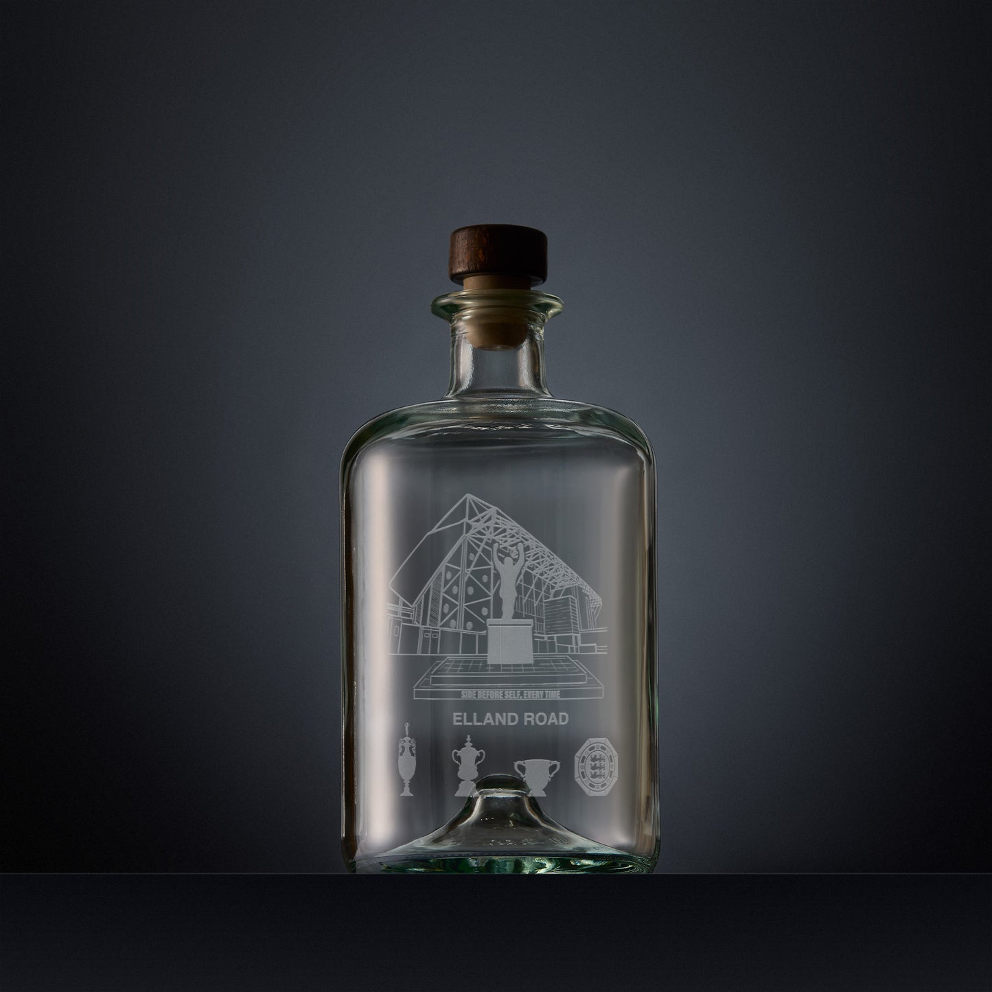 Engraved apothecary-style decanter with Elland Road stadium illustration