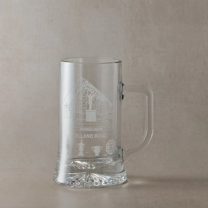 Clear glass tankard engraved with Elland Road stadium, photographed on a white background.