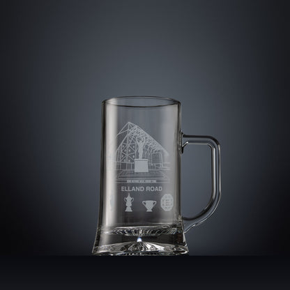 Engraved tankard featuring line-art architectural interpretation of Elland Road with trophy silhouettes beneath.