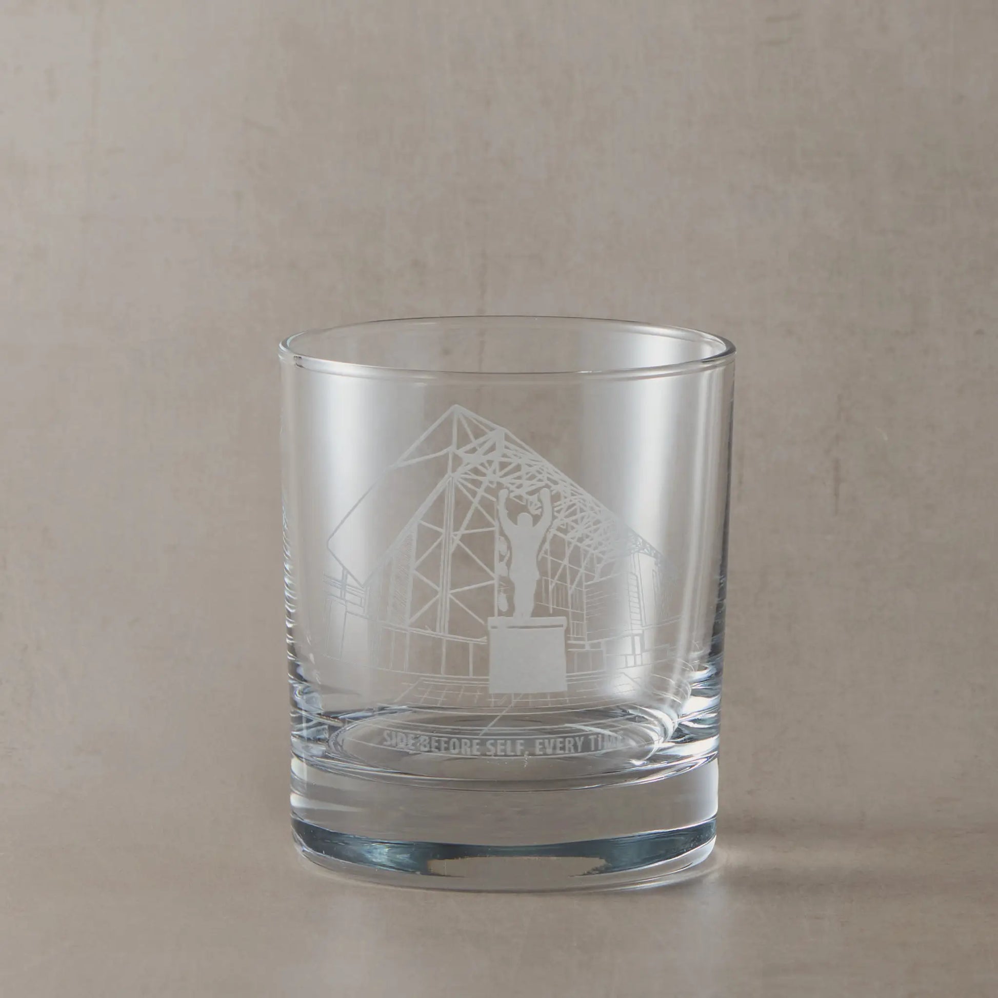 Engraved whisky glass line-art design of Elland Road stadium façade with space beneath for your own message