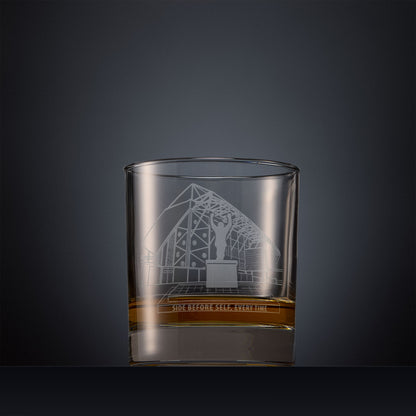 Engraved whisky glass featuring a line-art illustration of Elland Road stadium, shown on a dark background.