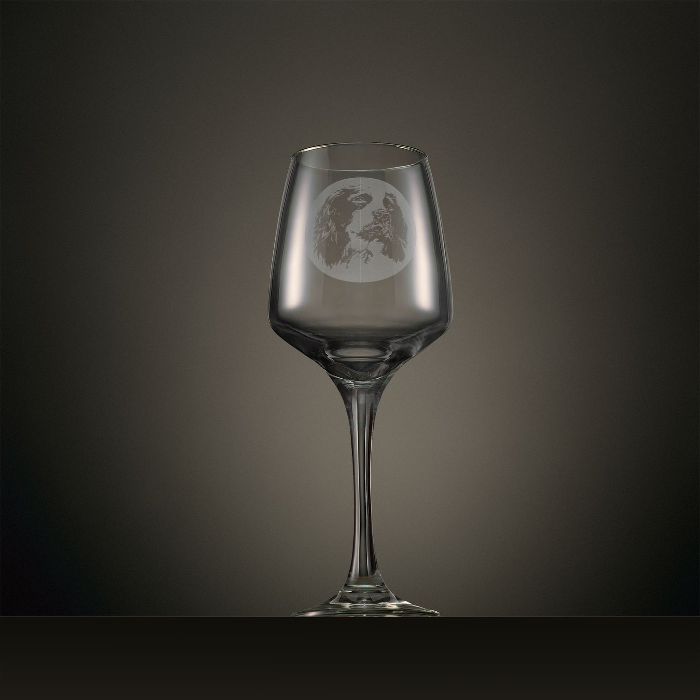 Engraved wine glass featuring a portrait English Springer Spaniel design, shown on a dark studio background