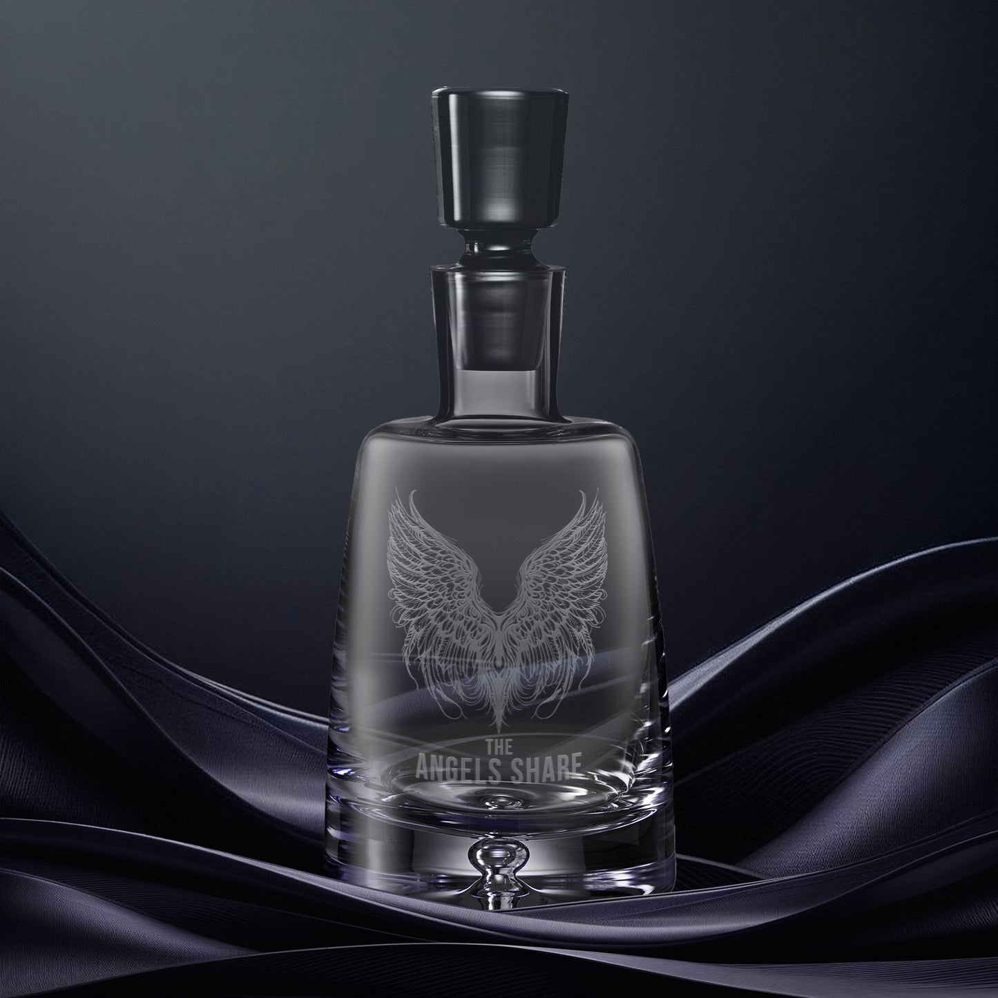 Engraved glass decanter illustrated with The Angels Share and pair of feathered wings