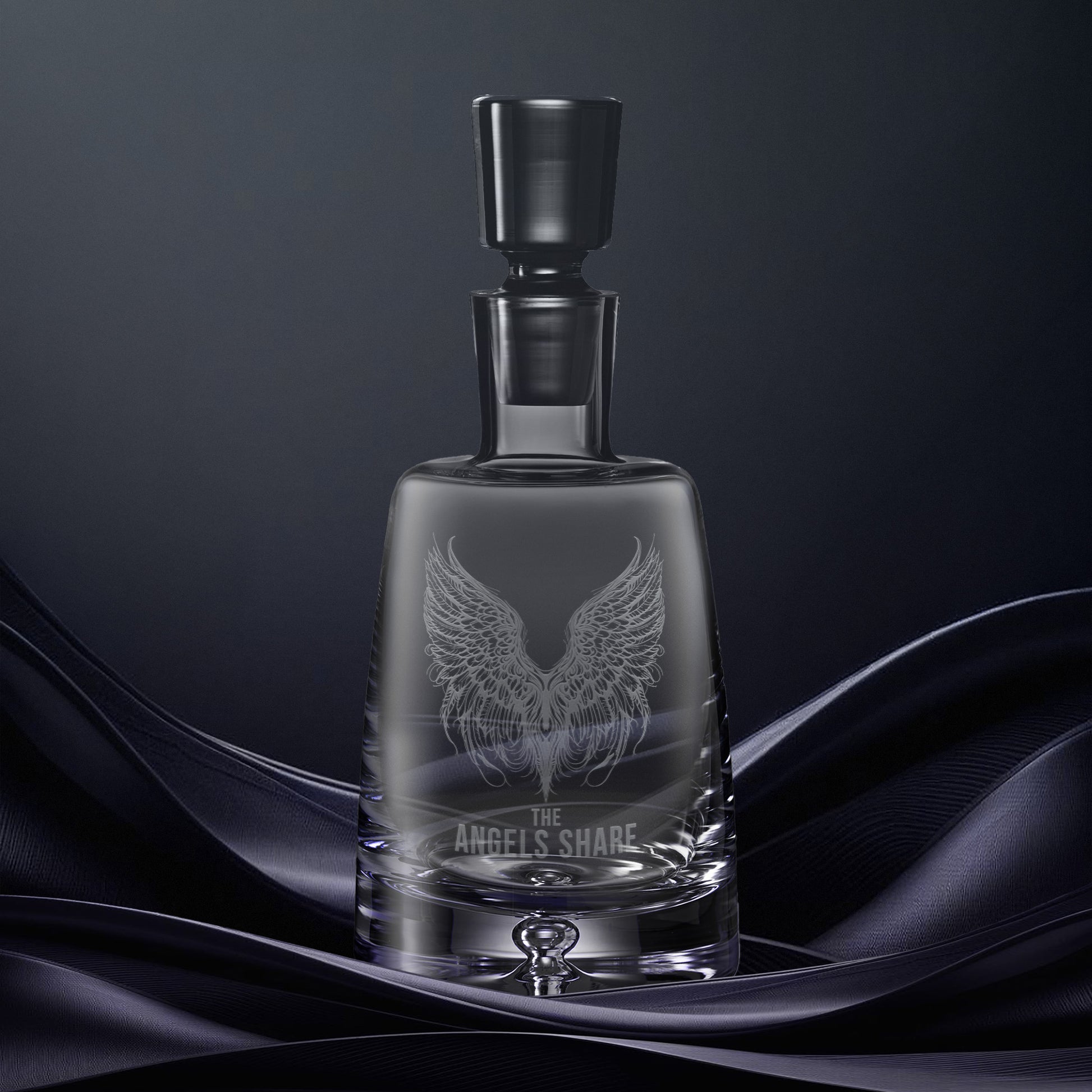 Engraved glass decanter illustrated with The Angels Share and pair of feathered wings