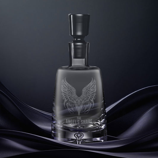 Engraved glass decanter illustrated with The Angels Share and pair of feathered wings