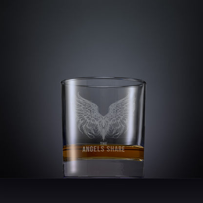 Engraved whisky glass with an  illustration of The Angels Share and a pair of wings