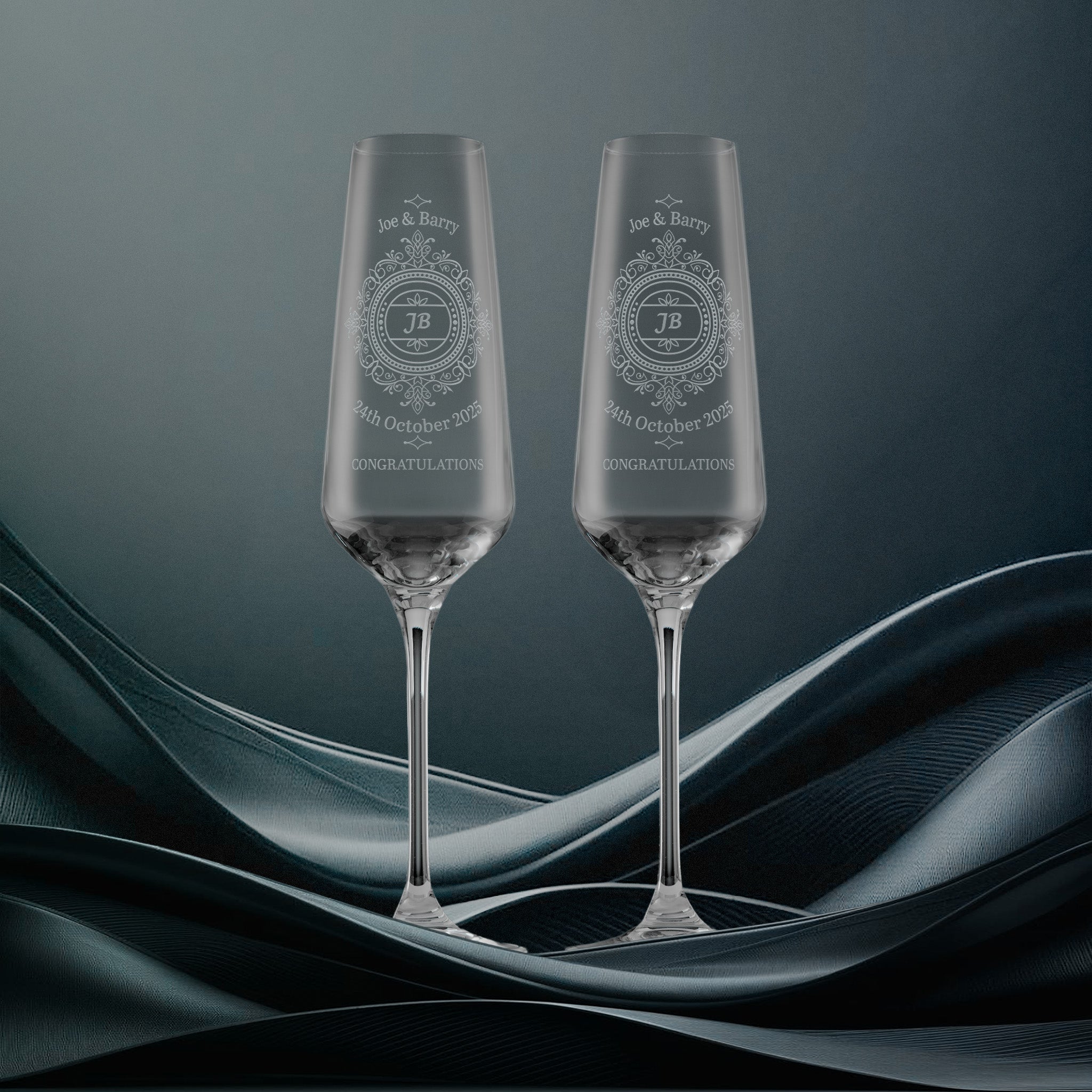Pair of anniversary champagne flutes engraved with a lace medallion design and personalised with names, dates and inscription