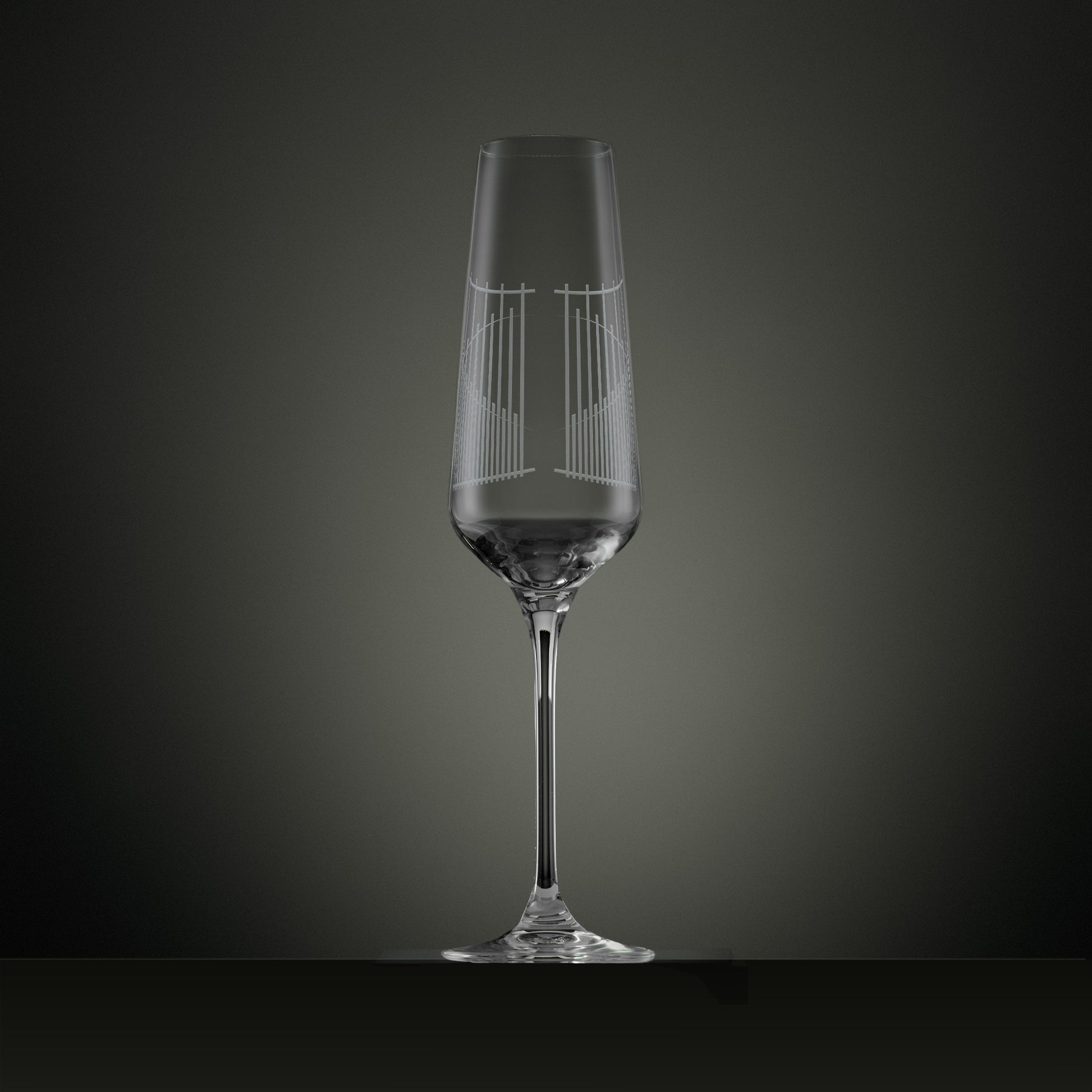 Engraved champagne flute showing the back detail of an illustration of the Ascot gates