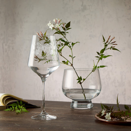 Engraved wine glass featuring gladioli, poppies and a comma butterfly in a wraparound composition