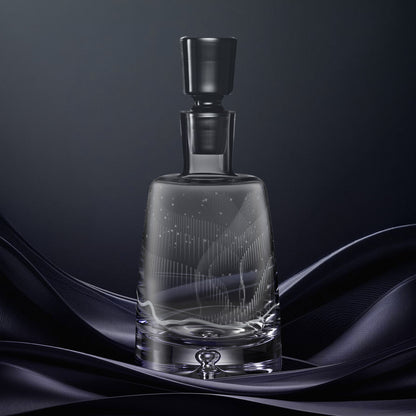 Hand engraved glass decanter featuring a wrap around Aurora Borealis design inspired by the Northern Lights.