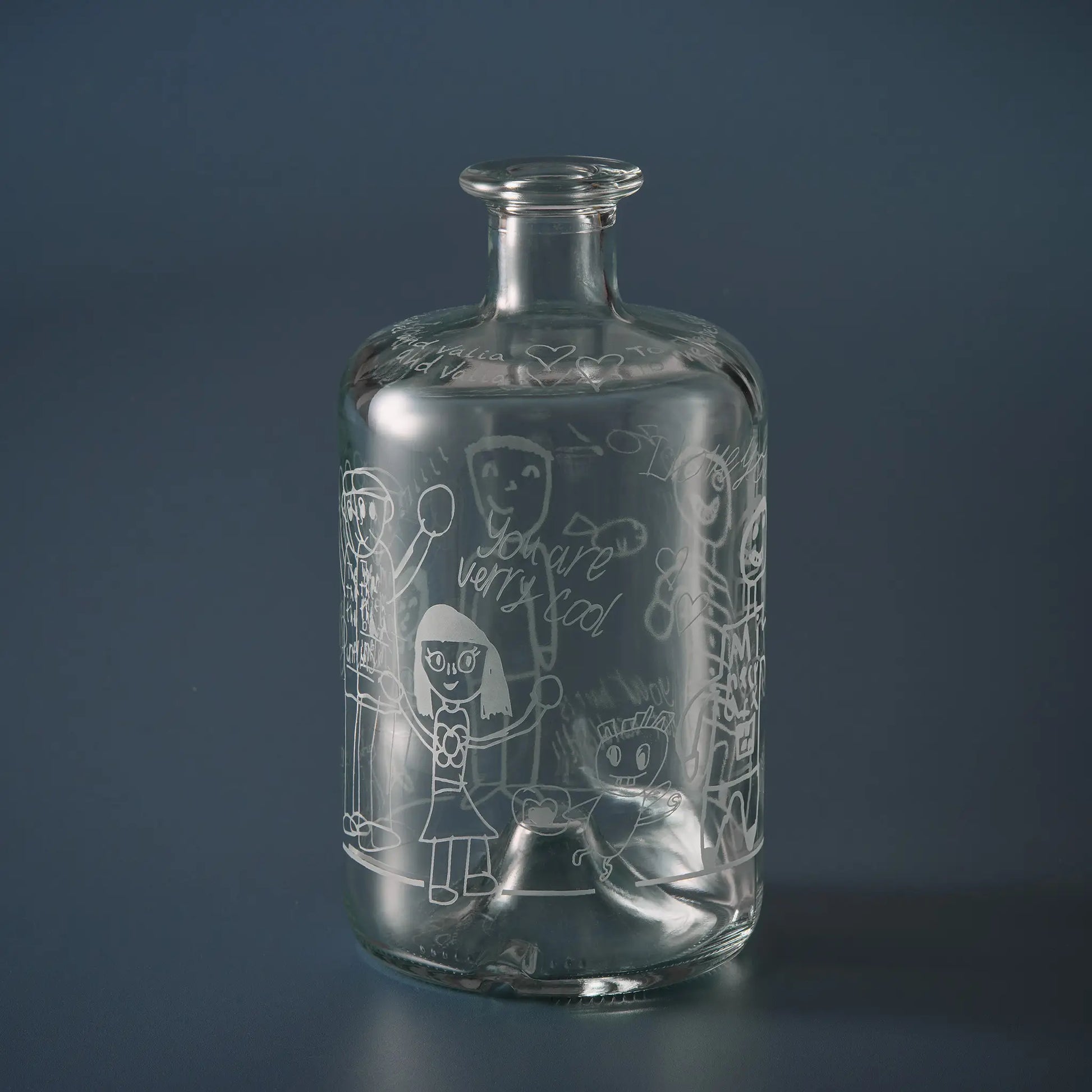 Apothecary style decanter engraved with grandchildren’s drawings of their granddad with child's handwritten messages