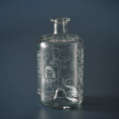 Apothecary style decanter engraved with grandchildren’s drawings of their granddad with child's handwritten messages