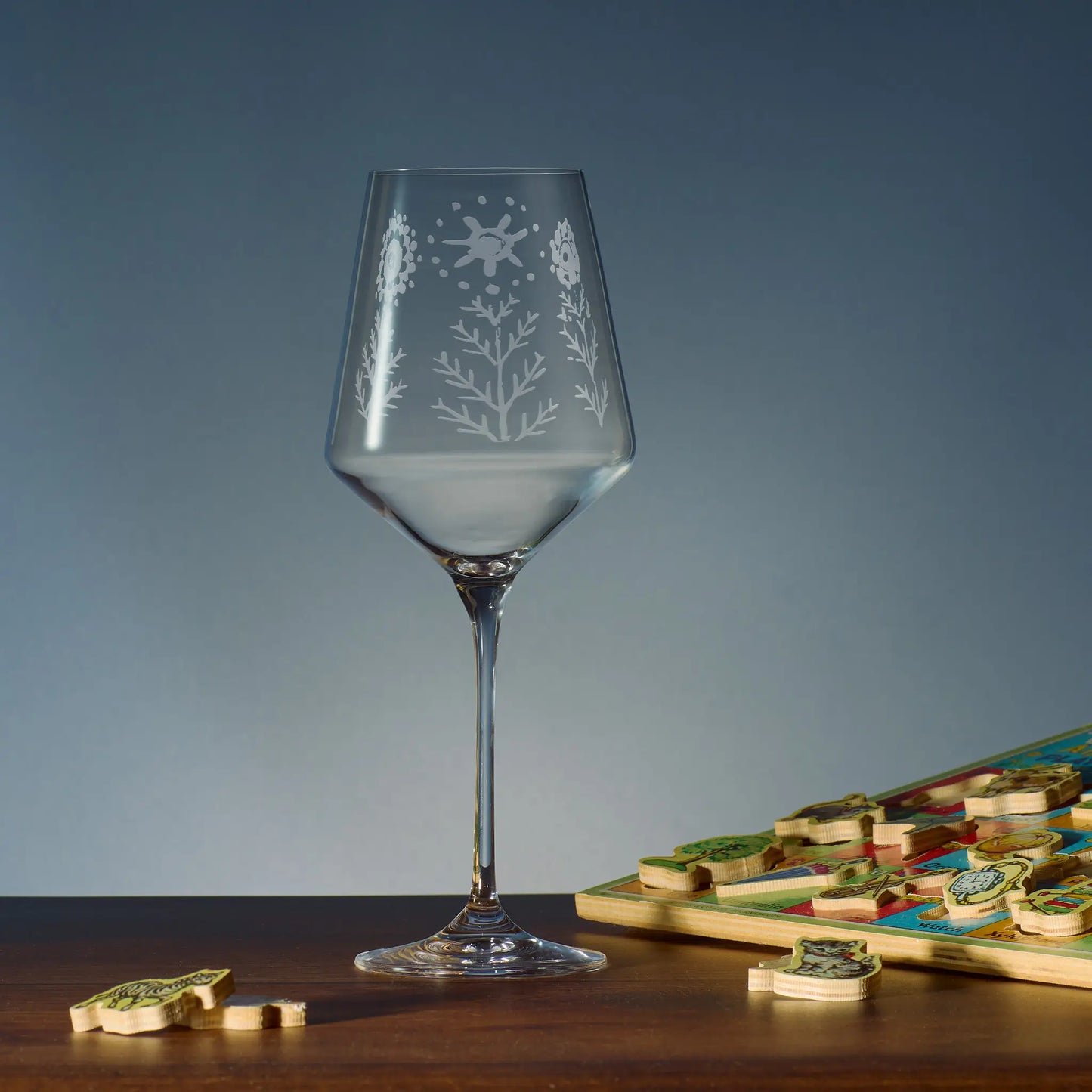 Engraved wine glass featuring flowers and leaves hand drawn by a child