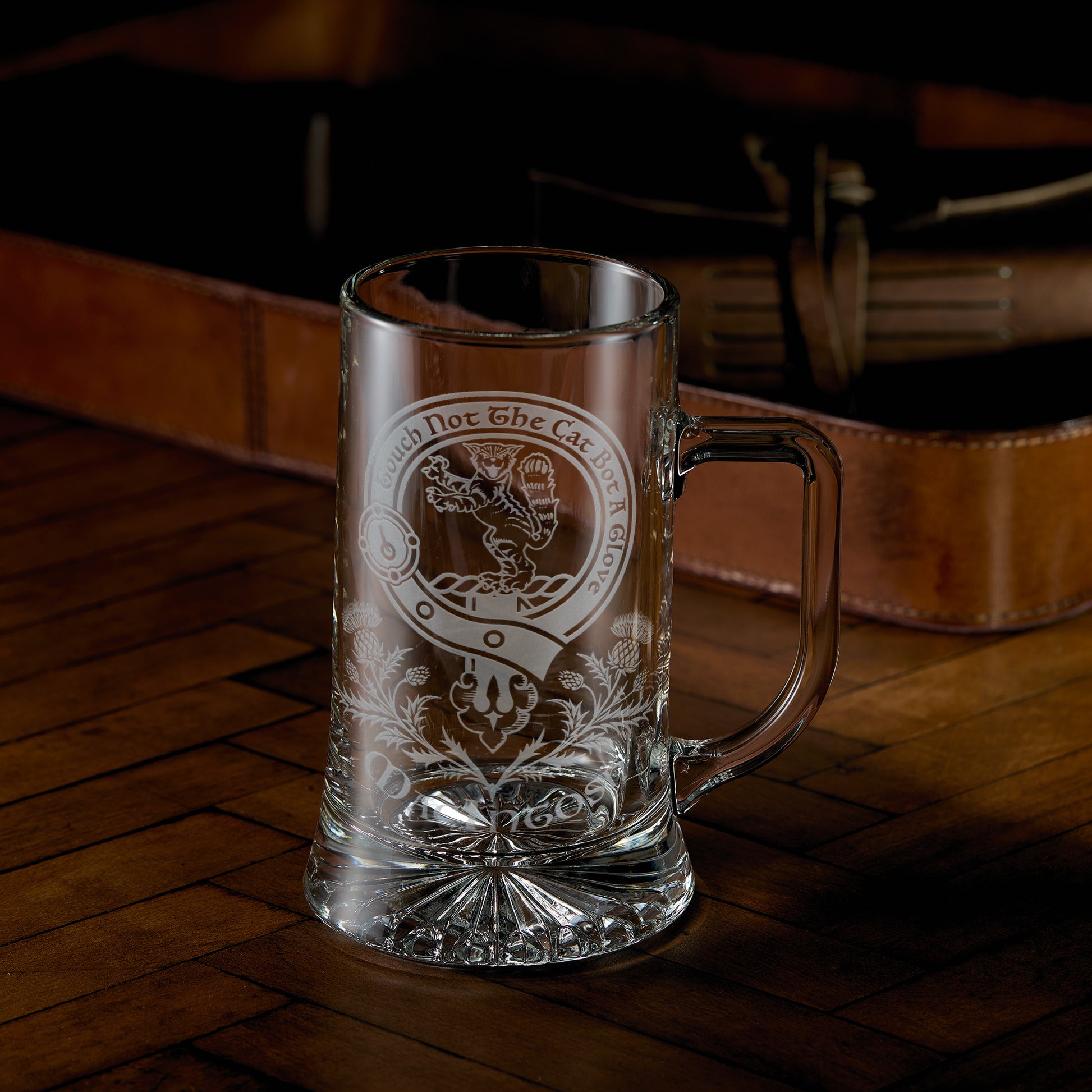 Engraved glass tankard with Scottish clan crest, belt and buckle design with thistles underneath