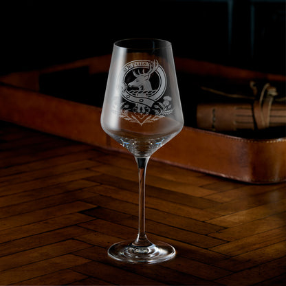 Engraved wine glass with Scottish clan crest, belt and buckle design with thistles underneath