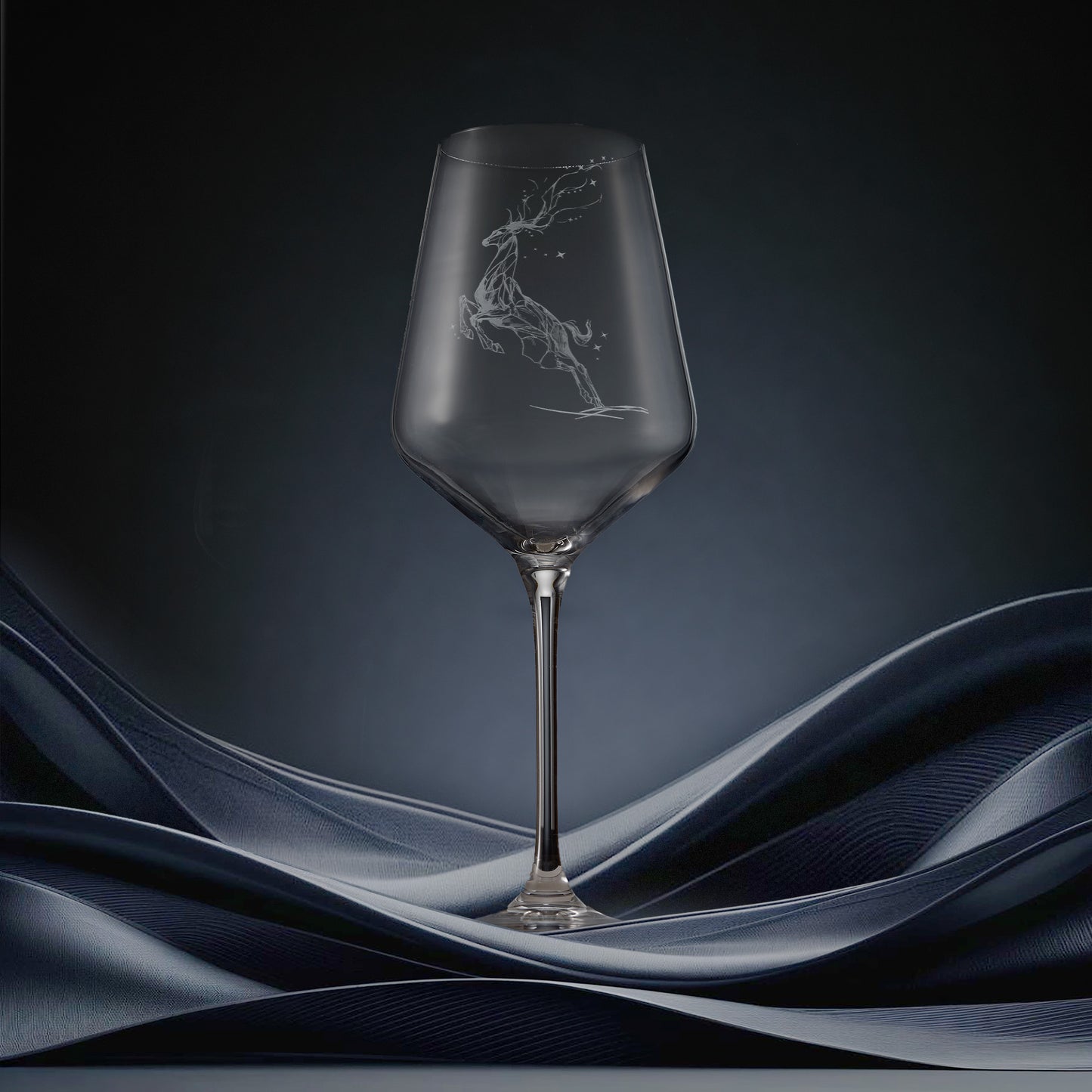 Engraved wine glass featuring a constellation design of stag leaping through stars