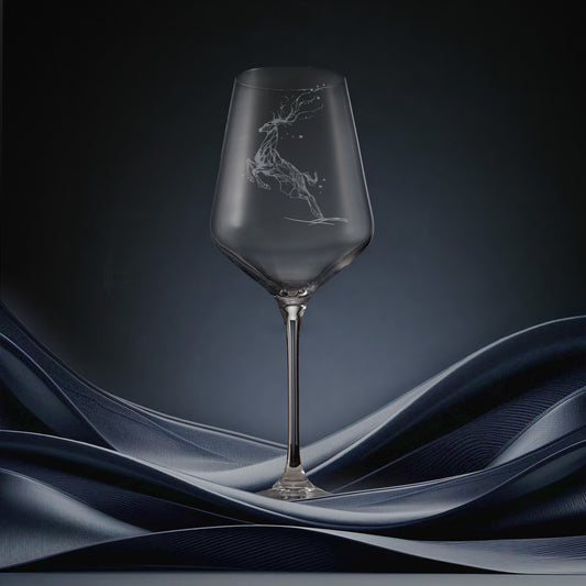 Engraved wine glass featuring a constellation design of stag leaping through stars