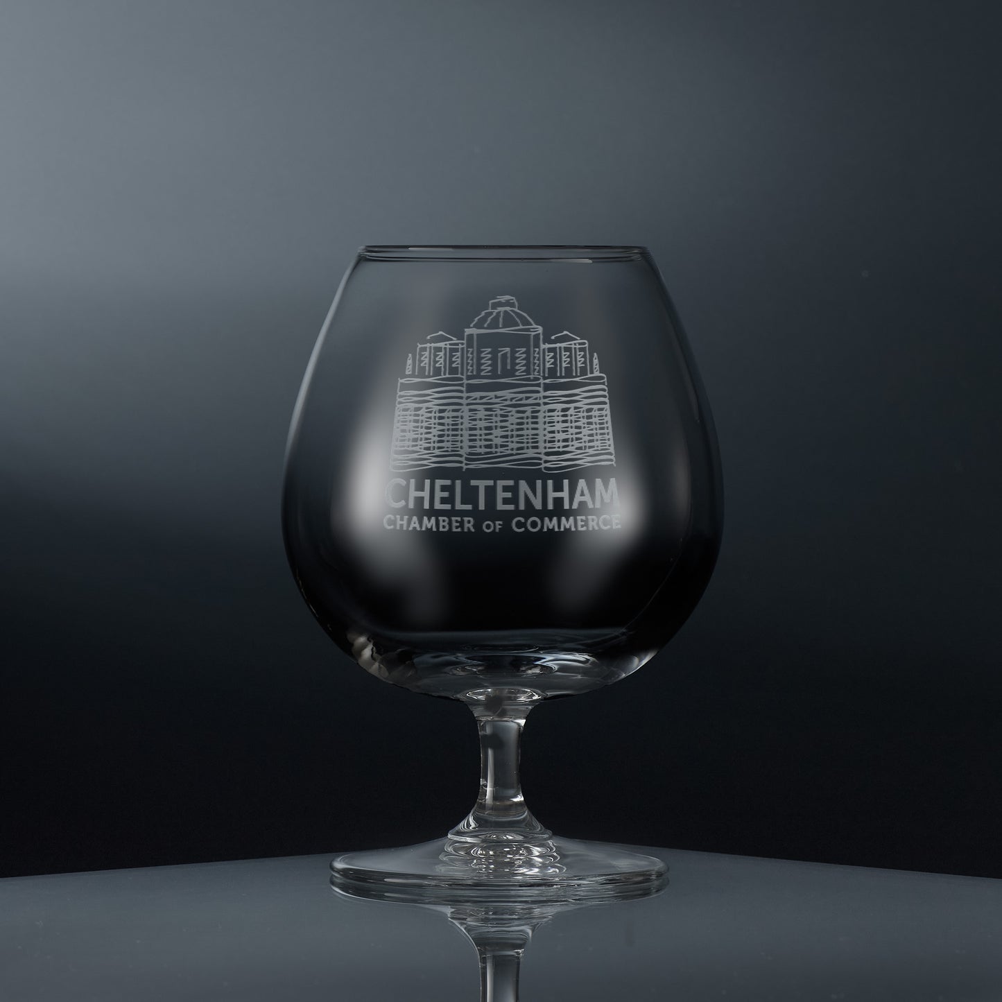 Engraved brandy glass featuring a corporate logo and personalised text