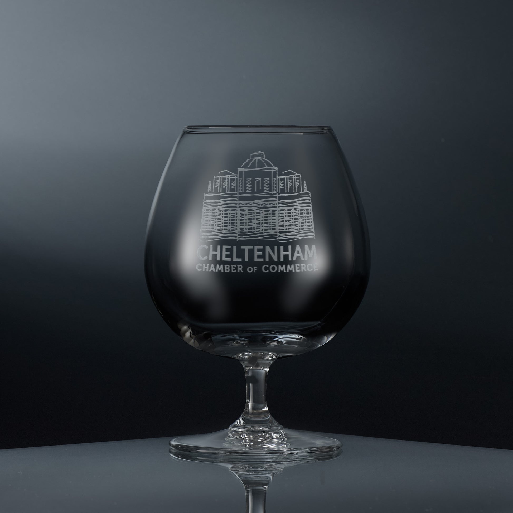Engraved brandy glass featuring a corporate logo and personalised text