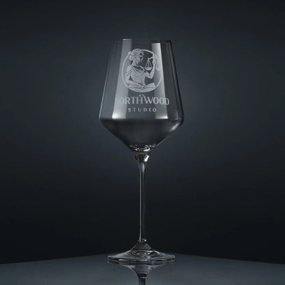 Bespoke engraved wine glass featuring a corporate branded logo and personalised text