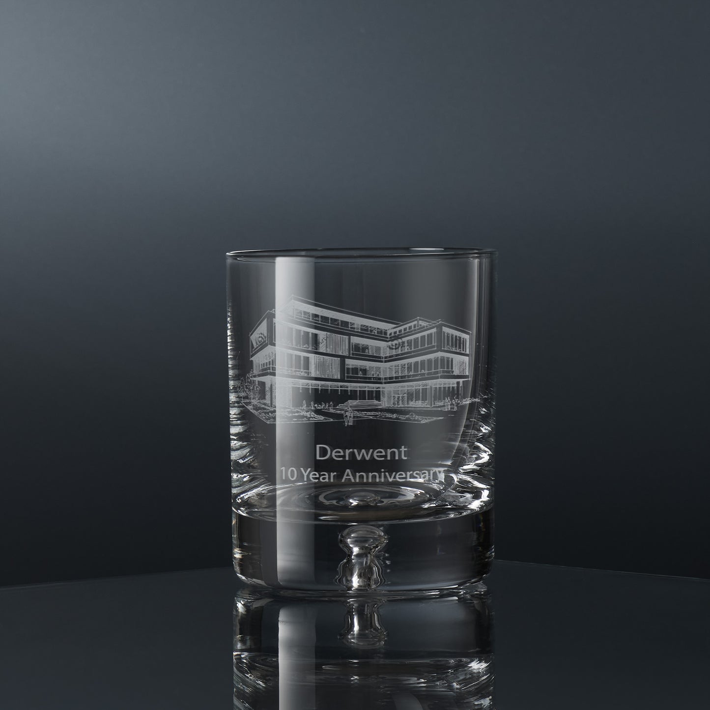 Engraved corporate whisky glass with a branded logo and personalised inscription