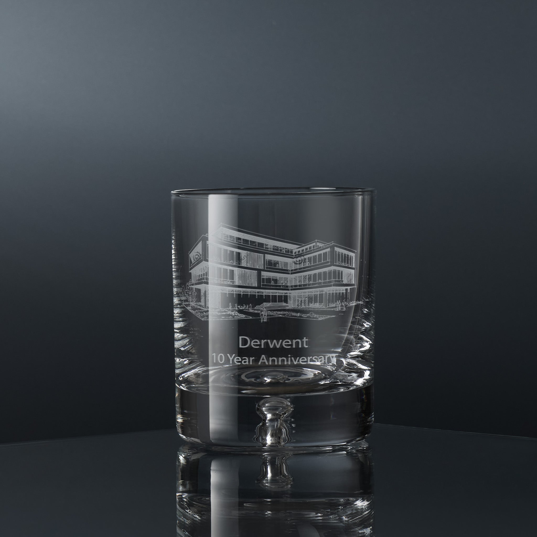 Engraved corporate whisky glass with a branded logo and personalised inscription
