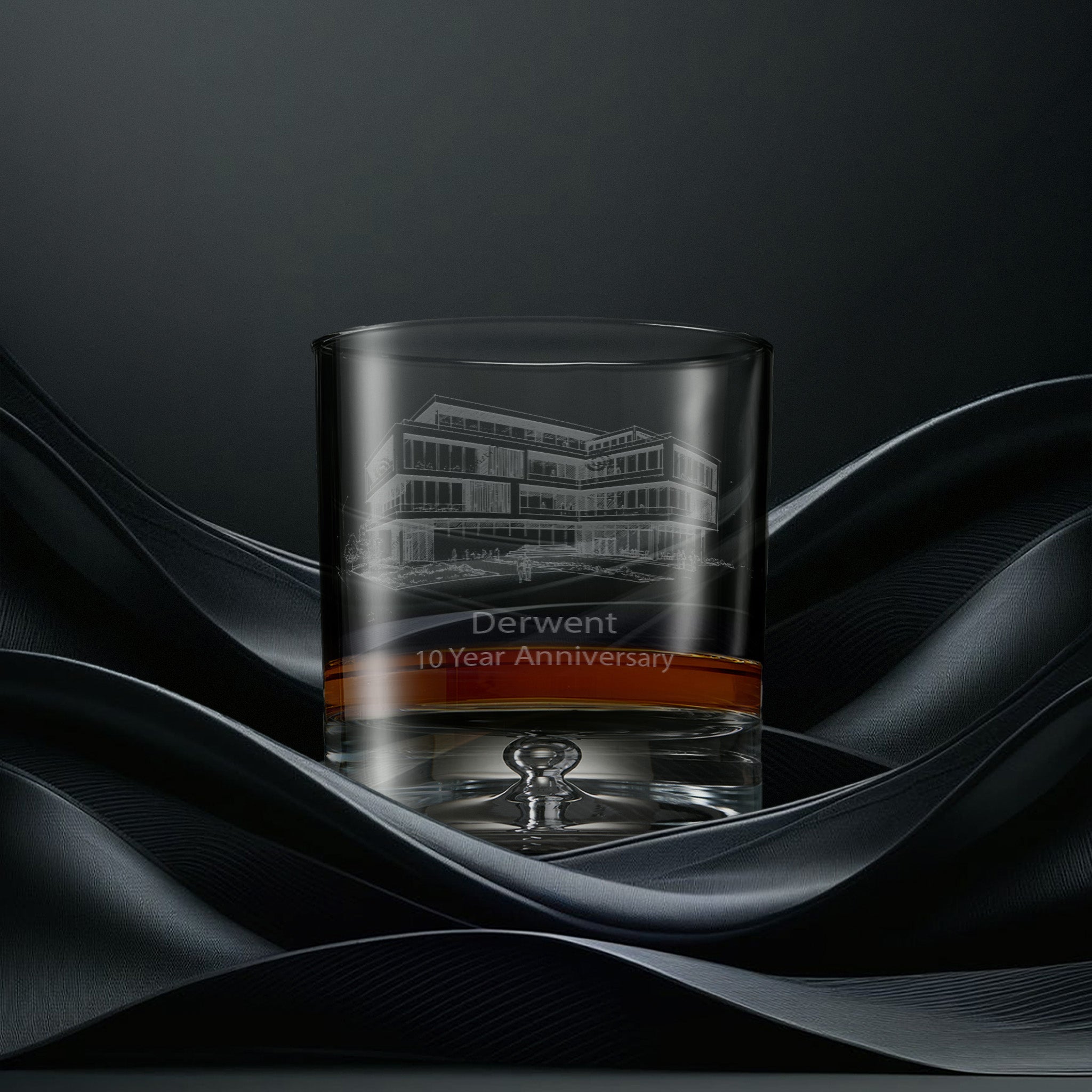 Engraved whisky glass with an  illustration of a corporate building and personalised inscription