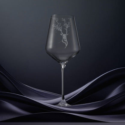 Hand engraved wine glass featuring the Deer Mother with branch antlers and stars inspired by northern folklore.