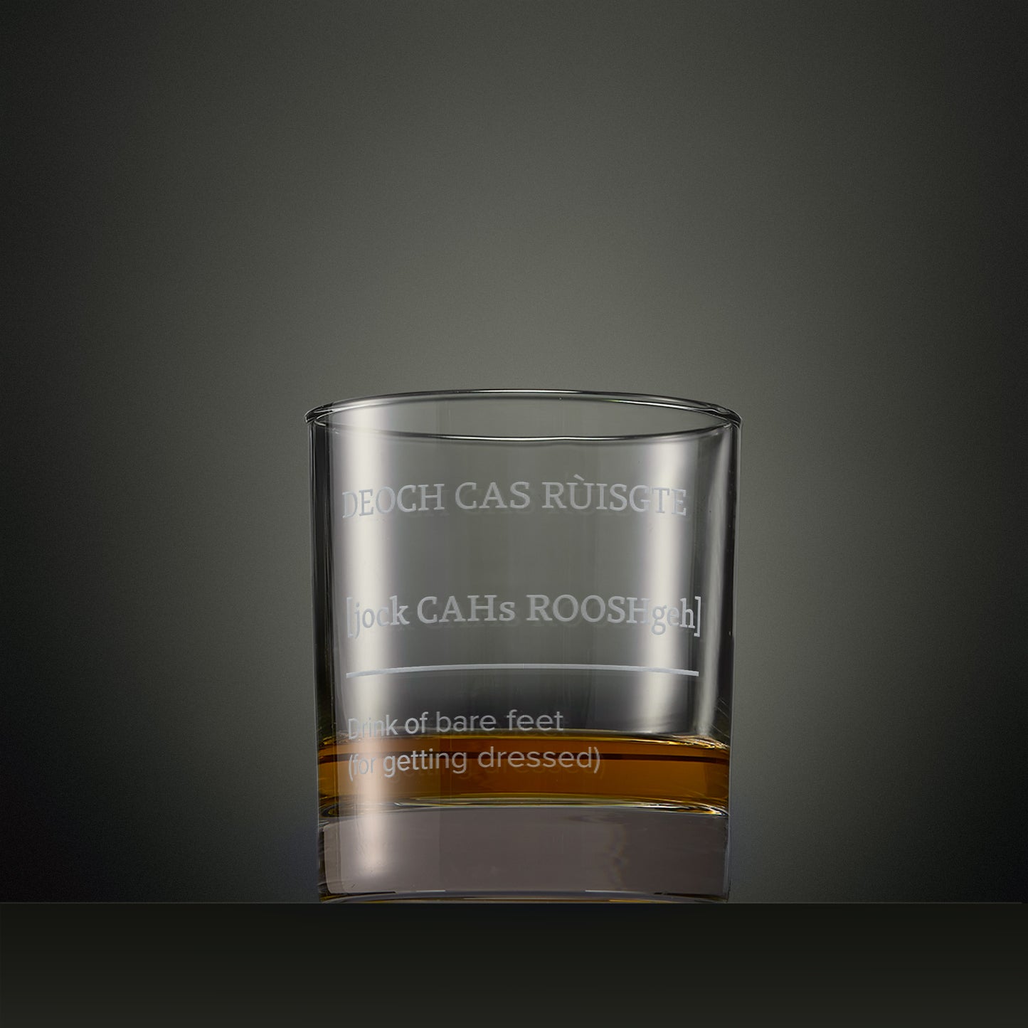 Engraved whisky glass featuring a Four Morning Drams Scottish Gaelic inscription with explanatory English text.