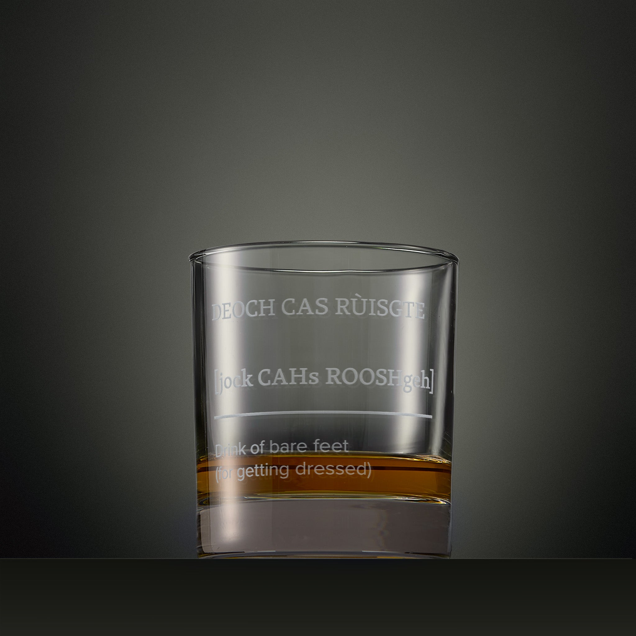 Engraved whisky glass featuring a Four Morning Drams Scottish Gaelic inscription with explanatory English text.