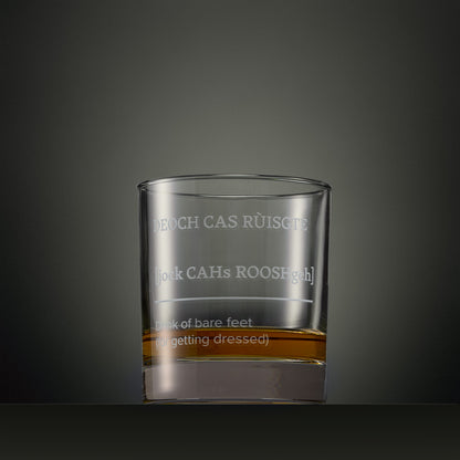 Engraved whisky glass featuring a Four Morning Drams Scottish Gaelic inscription with explanatory English text.