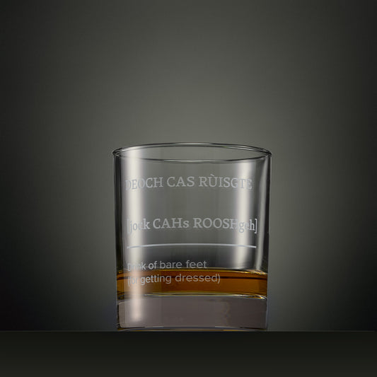 Engraved whisky glass featuring a Four Morning Drams Scottish Gaelic inscription with explanatory English text.