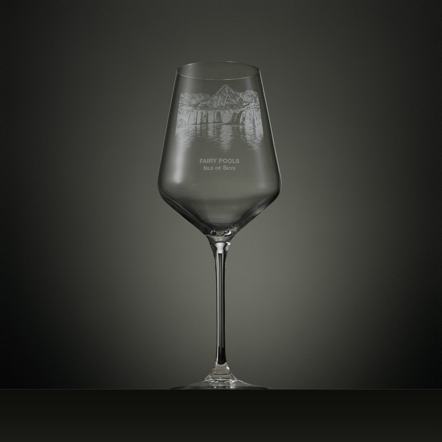 Engraved wine glass featuring the Fairy Pools on the Isle of Skye with cascading waterfalls, reflective pools and the Black Cuillin mountain range.
